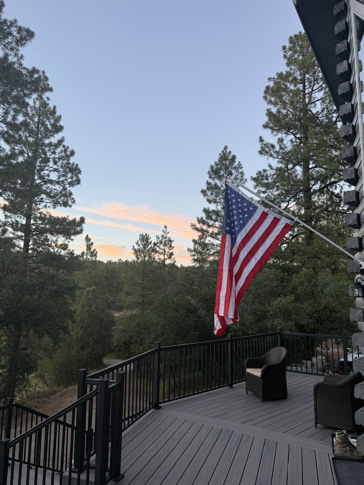 Cabin deck with an American flag at sunset